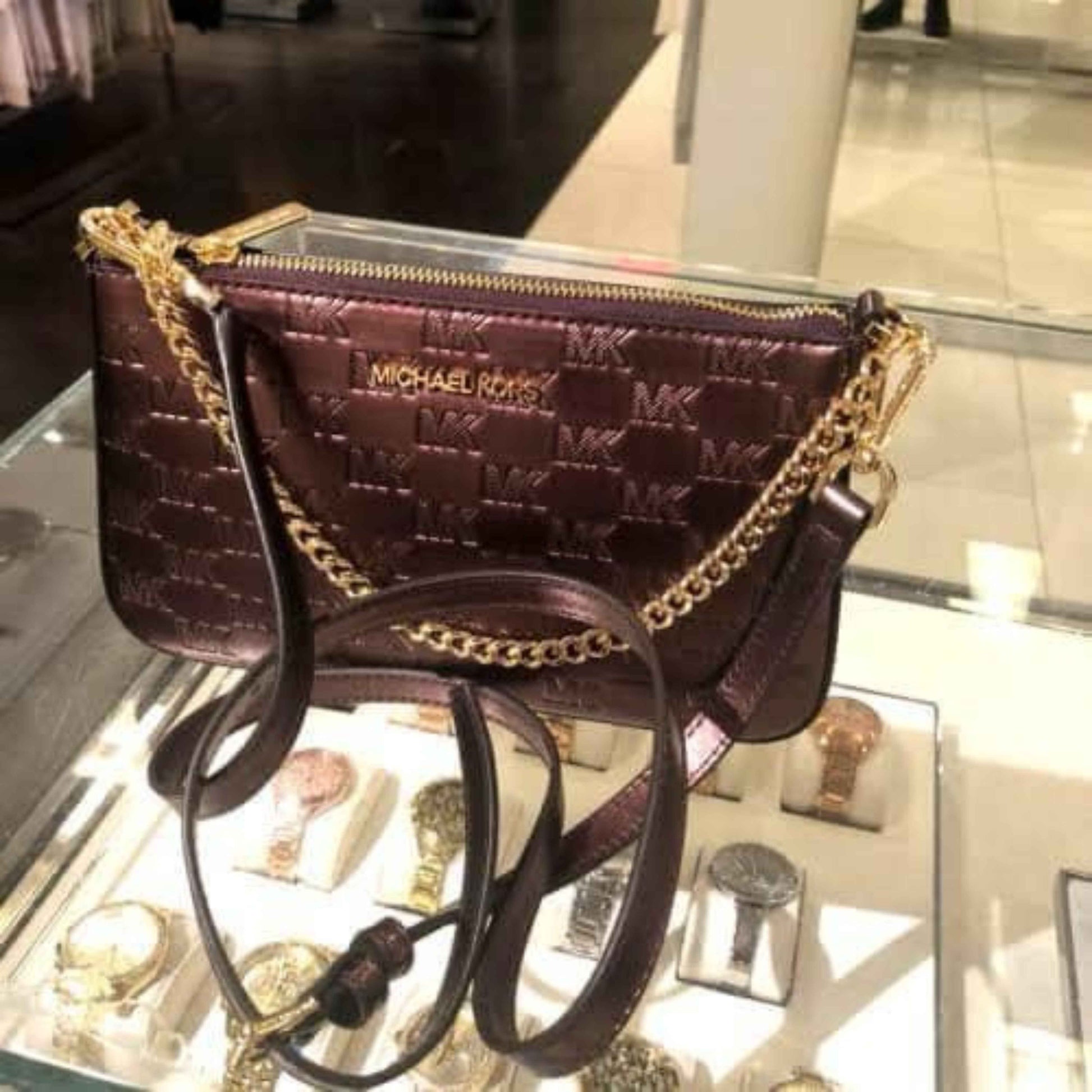 stunning micheal kor zip pouchette cross body 448$ - Bloom Shine