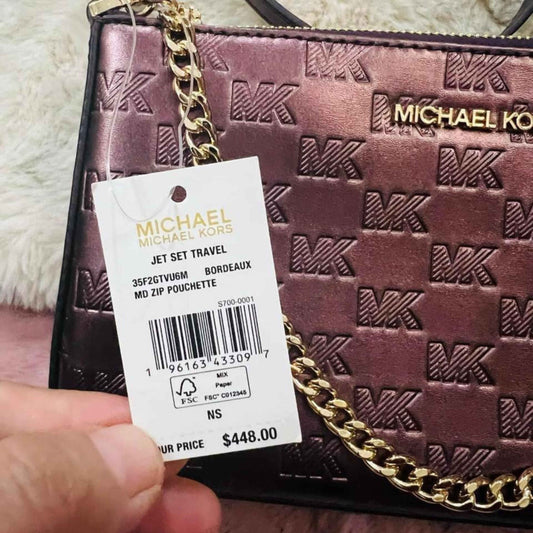 stunning micheal kor zip pouchette cross body 448$ - Bloom Shine